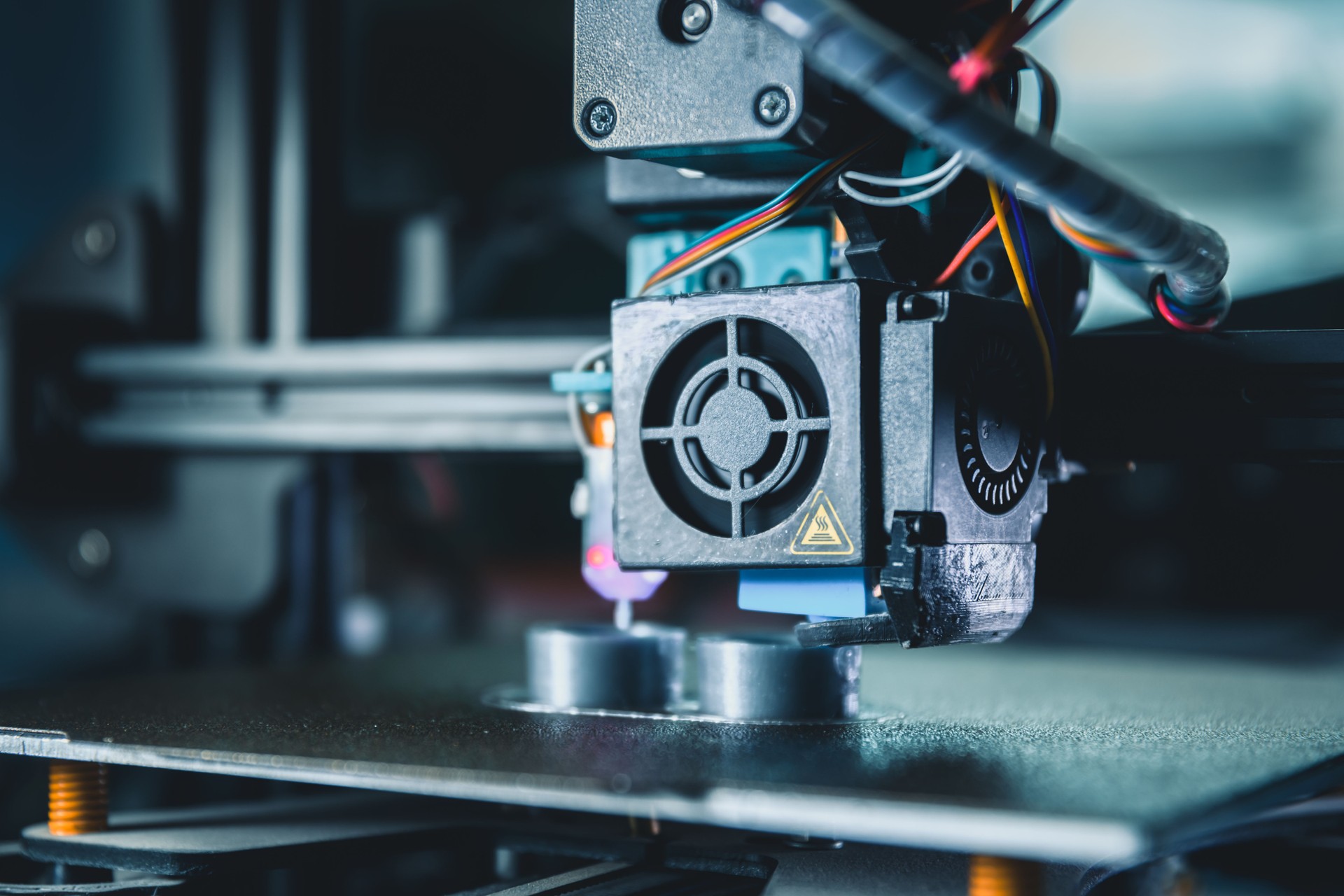 Modern 3d printer producing a new prototype model with melted material in an engineering laboratory, highlighting innovative technology for rapid prototyping and advanced manufacturing processes